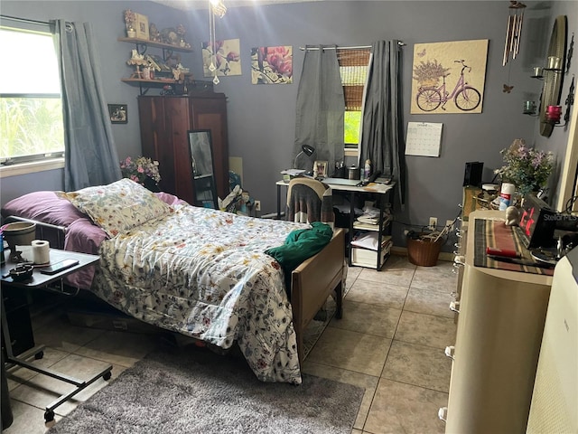 bedroom featuring light tile patterned flooring