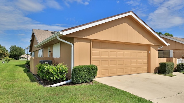 11 Andrea Dr, New Smyrna Beach, FL 32168 - view of front facade featuring a front yard, a garage, and a shingled roof