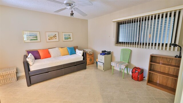 11 Andrea Dr, New Smyrna Beach, FL 32168 - living area with a ceiling fan and a textured ceiling