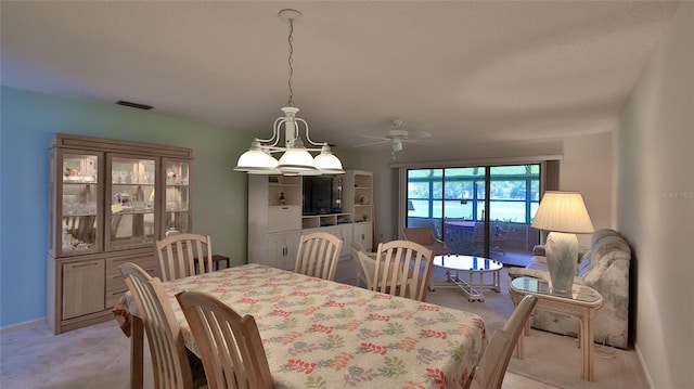 dining room with light tile patterned floors and ceiling fan