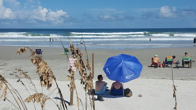 view of water feature with a beach view