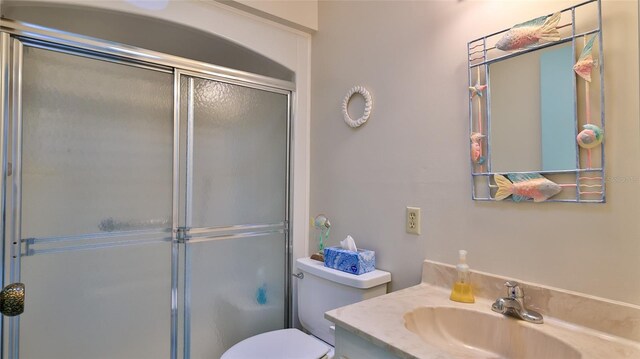 11 Andrea Dr, New Smyrna Beach, FL 32168 - full bathroom with a shower stall, vanity, and toilet