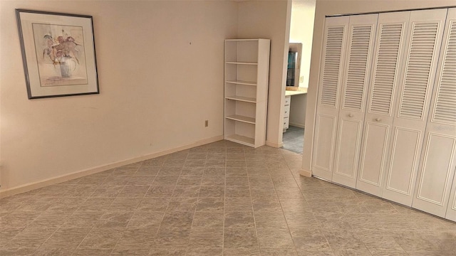 unfurnished bedroom featuring a closet