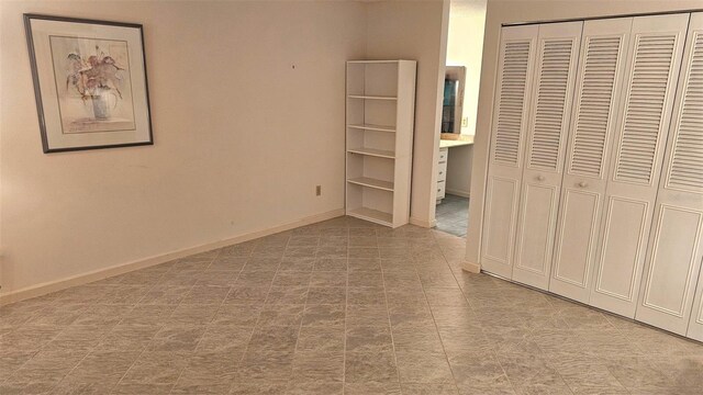 11 Andrea Dr, New Smyrna Beach, FL 32168 - unfurnished bedroom with a closet and baseboards