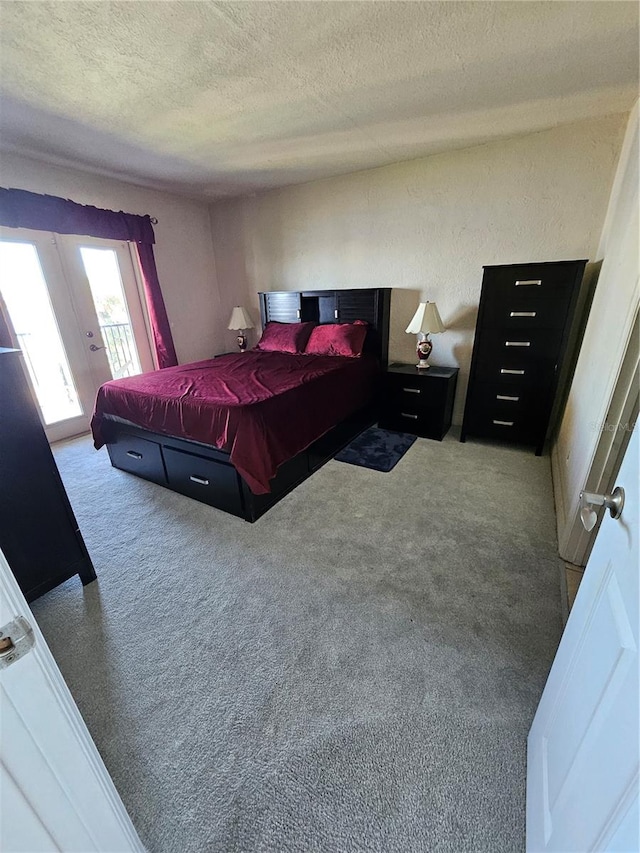 carpeted bedroom with a textured ceiling