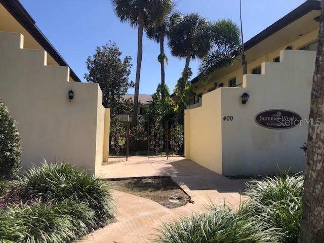 400 Oakridge Blvd Unit 6, Daytona Beach, FL 32118 - exterior space featuring a gate and stucco siding