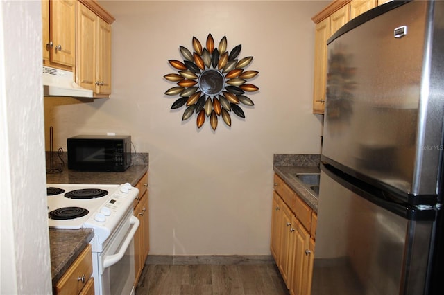 400 Oakridge Blvd Unit 6, Daytona Beach, FL 32118 - kitchen with freestanding refrigerator, black microwave, dark countertops, white range with electric cooktop, and under cabinet range hood