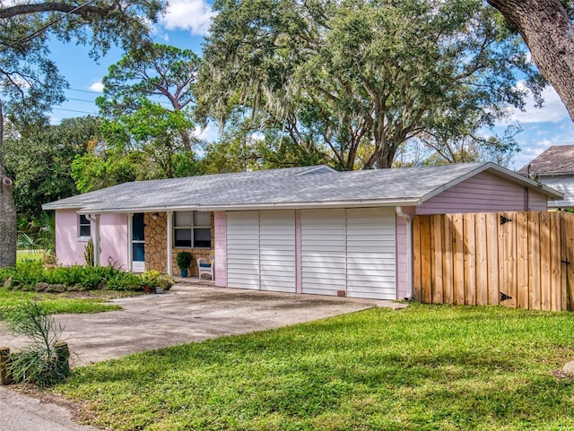 view of front facade with a front lawn and a garage