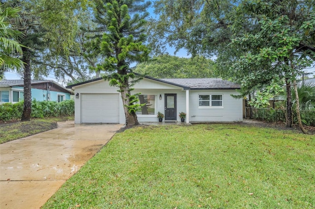 single story home featuring a garage and a front lawn