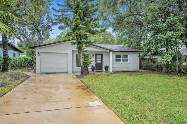 single story home with a garage and a front lawn