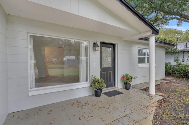 doorway to property with a patio area