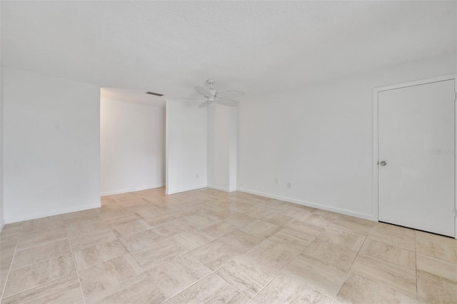 spare room featuring ceiling fan