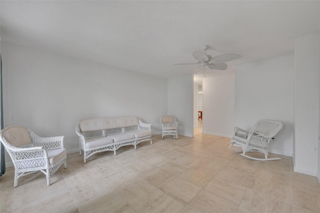 living area with ceiling fan