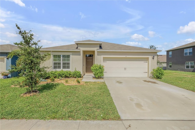 view of front facade featuring a garage and a front yard