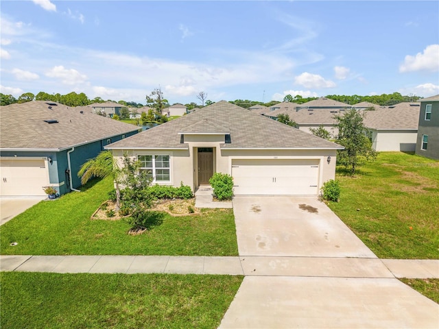 ranch-style home with a garage and a front lawn