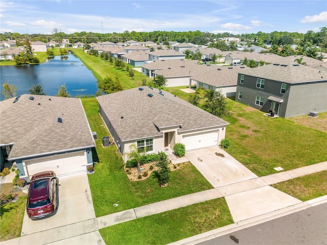 drone / aerial view with a water view