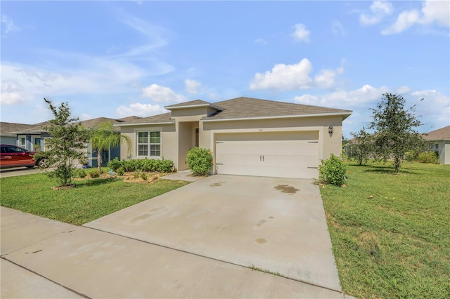 view of front of home featuring a garage and a front lawn