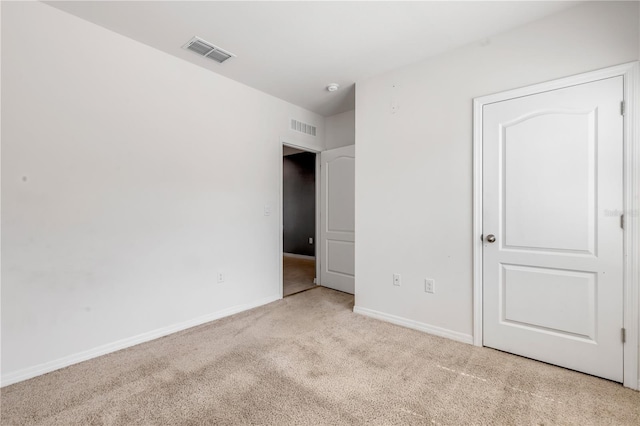 unfurnished bedroom with light carpet