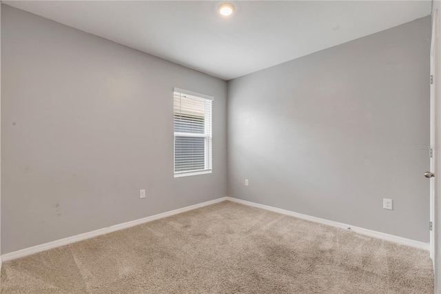 unfurnished room with carpet floors