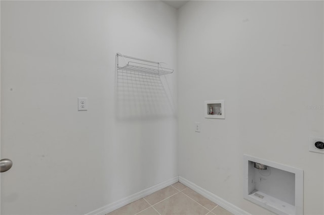 laundry area with hookup for a washing machine, light tile patterned floors, and electric dryer hookup