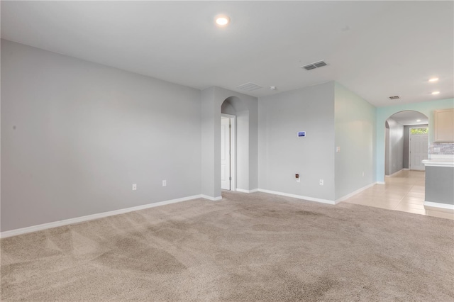 empty room featuring light carpet