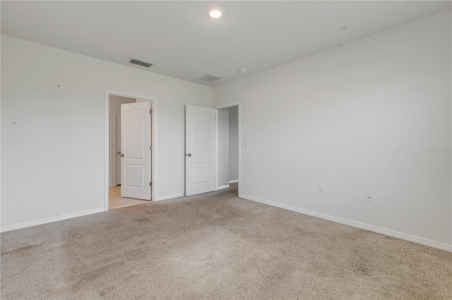 unfurnished bedroom with light carpet