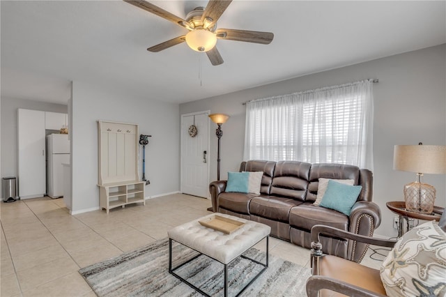 living room featuring ceiling fan and light tile patterned floors