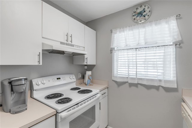 kitchen with white appliances and white cabinets