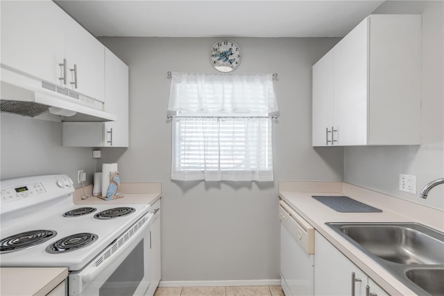 kitchen featuring white appliances, sink, and white cabinetry