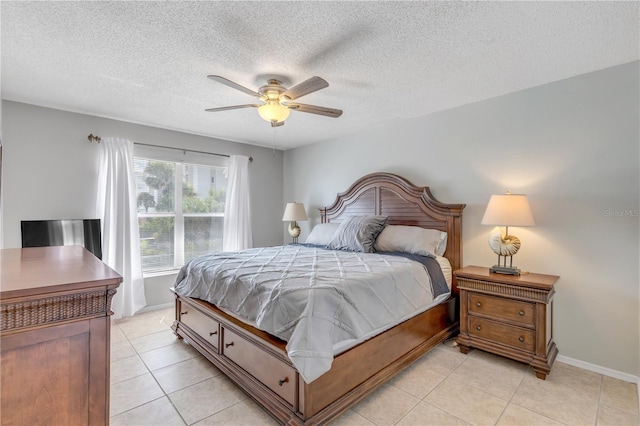 bedroom featuring ceiling fan, a textured ceiling, and light tile patterned floors