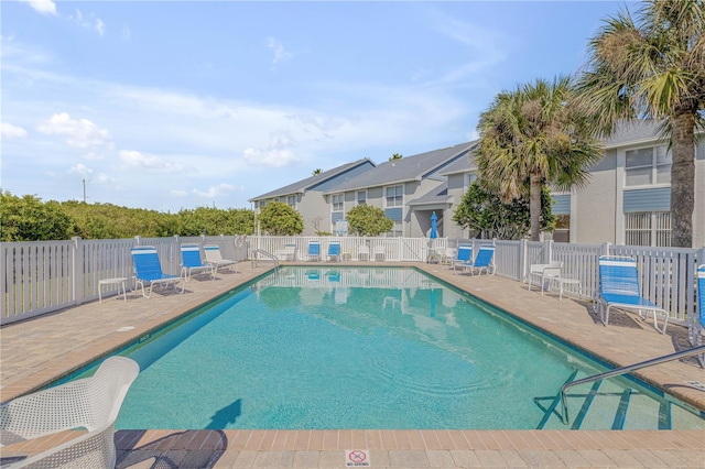 view of swimming pool with a patio area