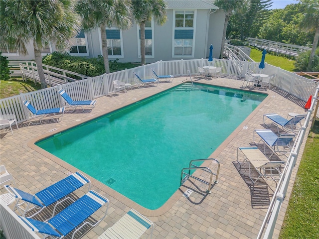 view of pool featuring a patio