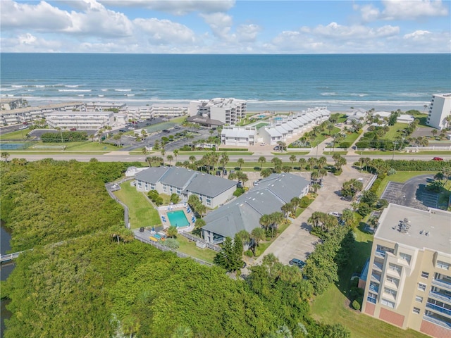 bird's eye view featuring a water view and a view of the beach