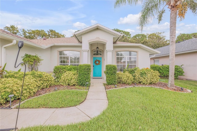 view of front of home featuring a front lawn