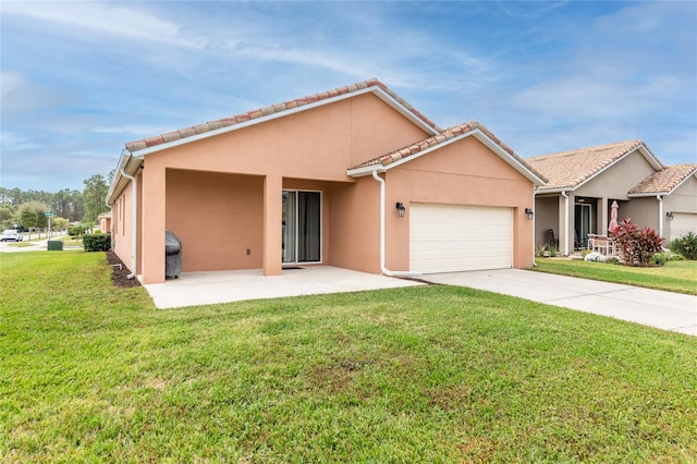 view of front facade with a front yard and a garage