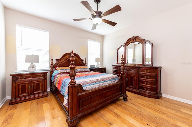 bedroom with ceiling fan and light hardwood / wood-style floors