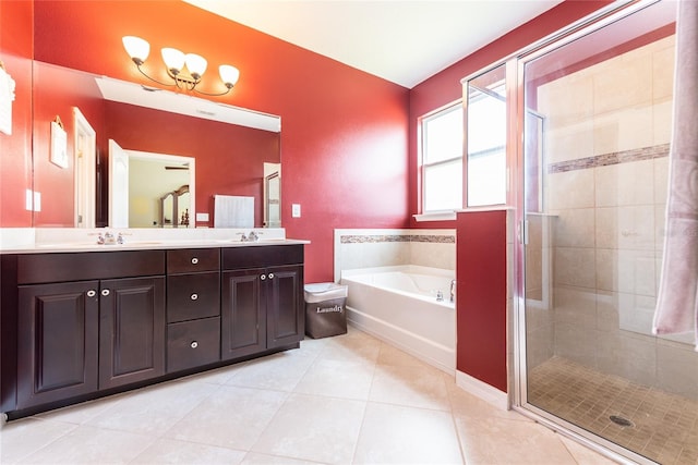 bathroom with tile patterned floors, vanity, and independent shower and bath