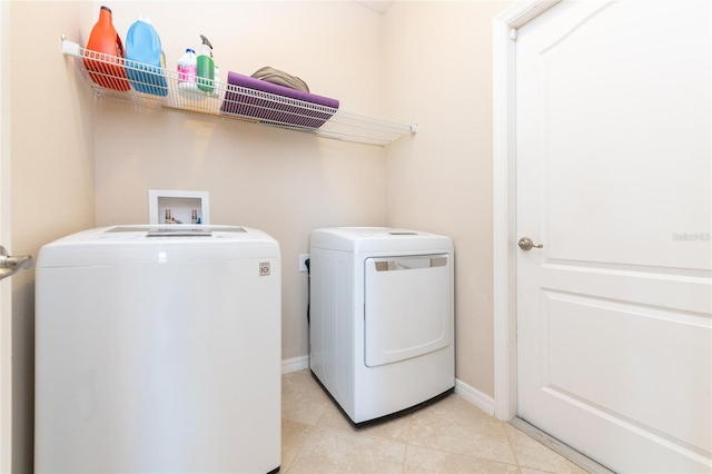 washroom with washing machine and clothes dryer