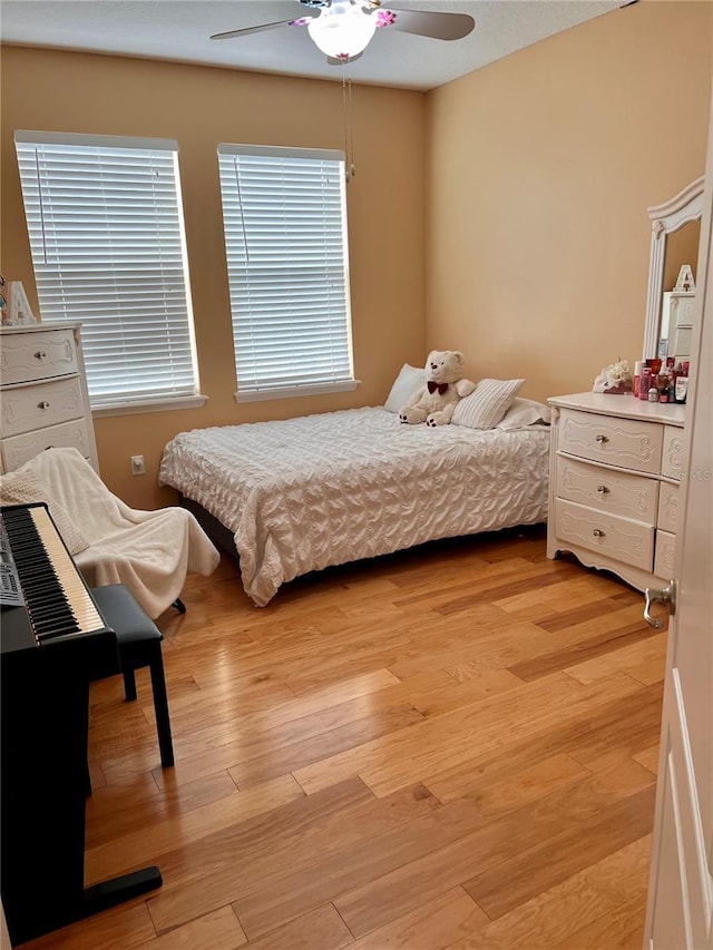 bedroom featuring ceiling fan and light wood-type flooring