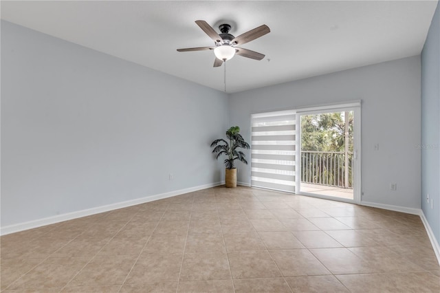 empty room featuring light tile patterned flooring and ceiling fan