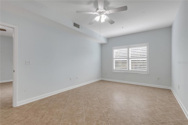 unfurnished room with light tile patterned floors and ceiling fan