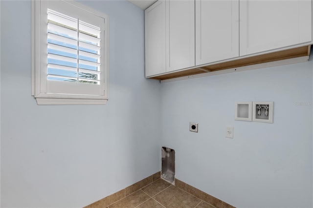 laundry room with washer hookup, cabinets, light tile patterned floors, and electric dryer hookup