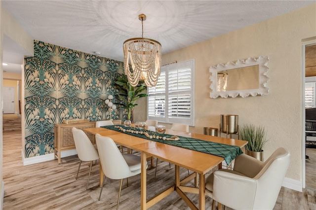 dining room featuring an inviting chandelier and wood-type flooring