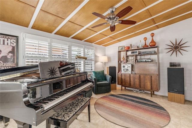 misc room featuring vaulted ceiling, light tile patterned floors, and ceiling fan