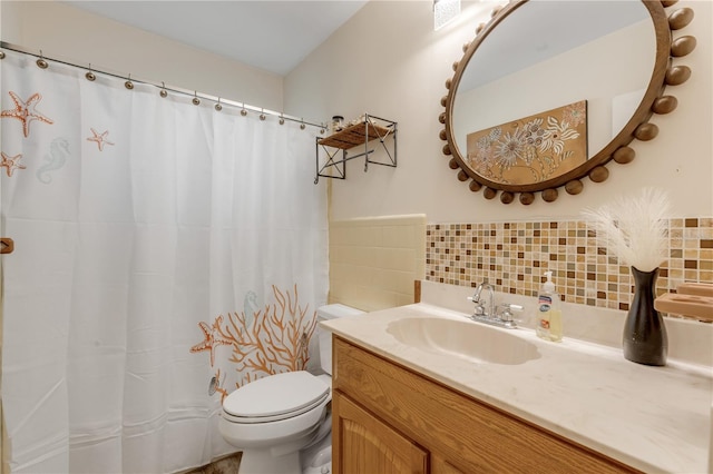 bathroom featuring backsplash, tile walls, toilet, vanity, and curtained shower