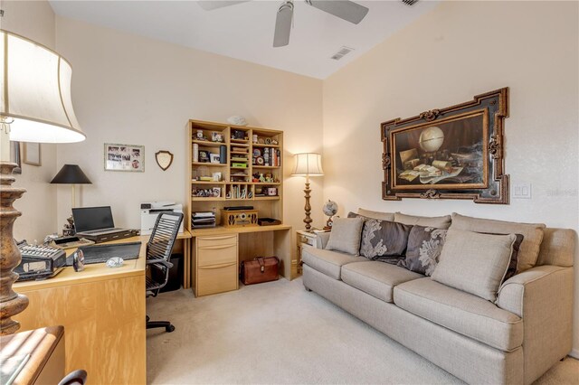 carpeted home office with ceiling fan