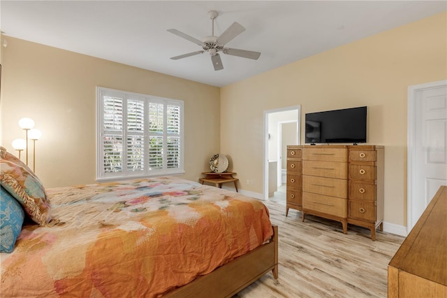 bedroom with light wood-type flooring and ceiling fan