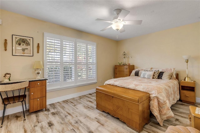 bedroom featuring light hardwood / wood-style flooring and ceiling fan