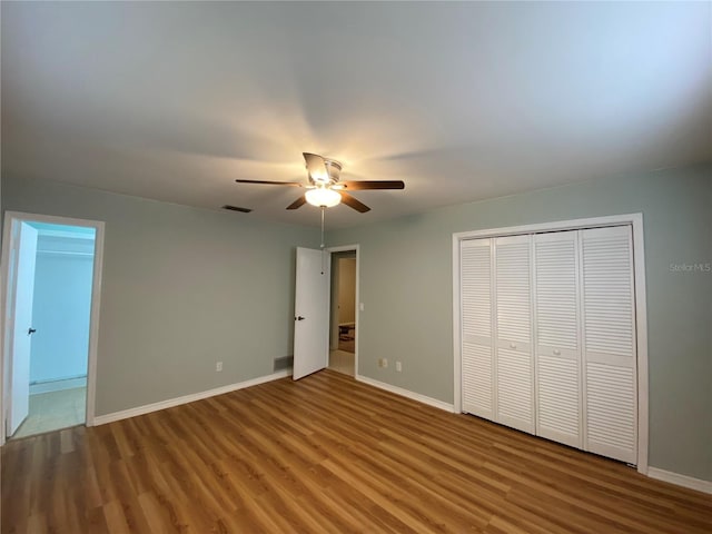 unfurnished bedroom featuring wood-type flooring and ceiling fan