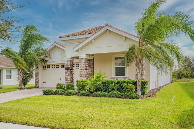 mediterranean / spanish-style house featuring a front yard and a garage